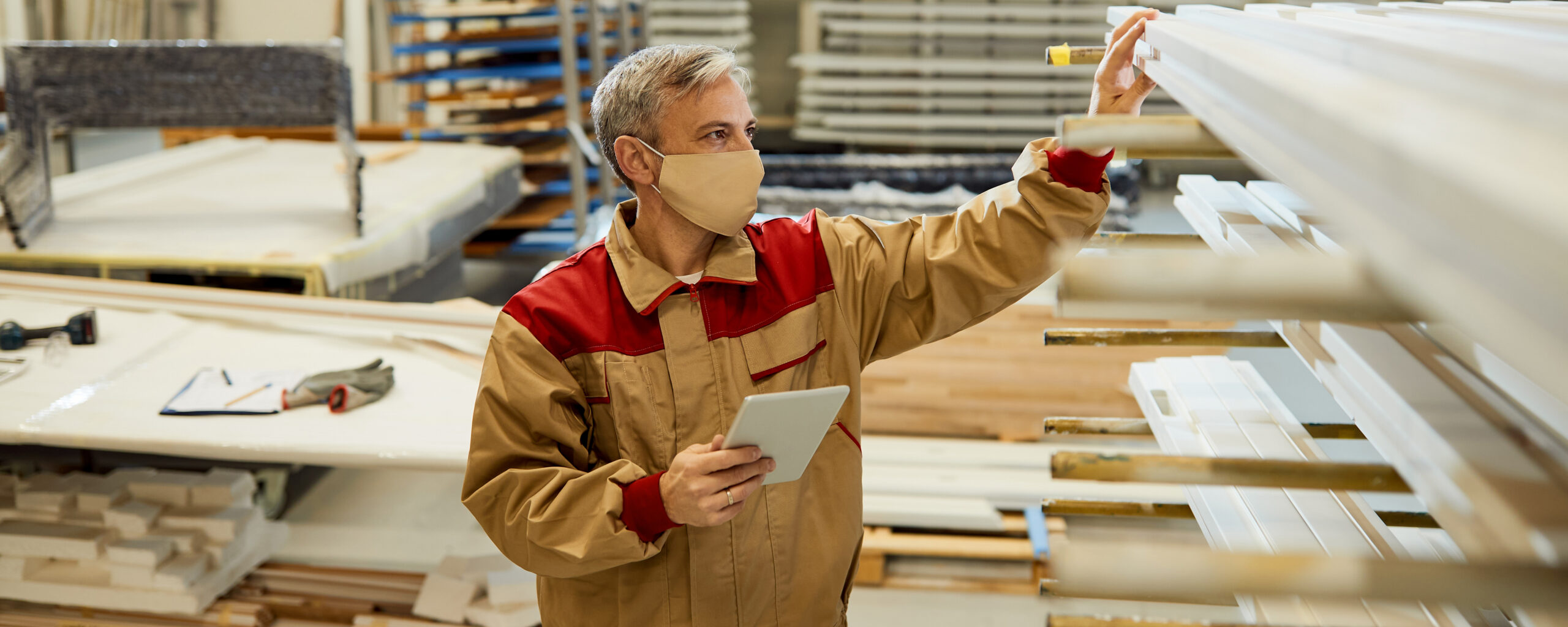 worker checking warehouse costs