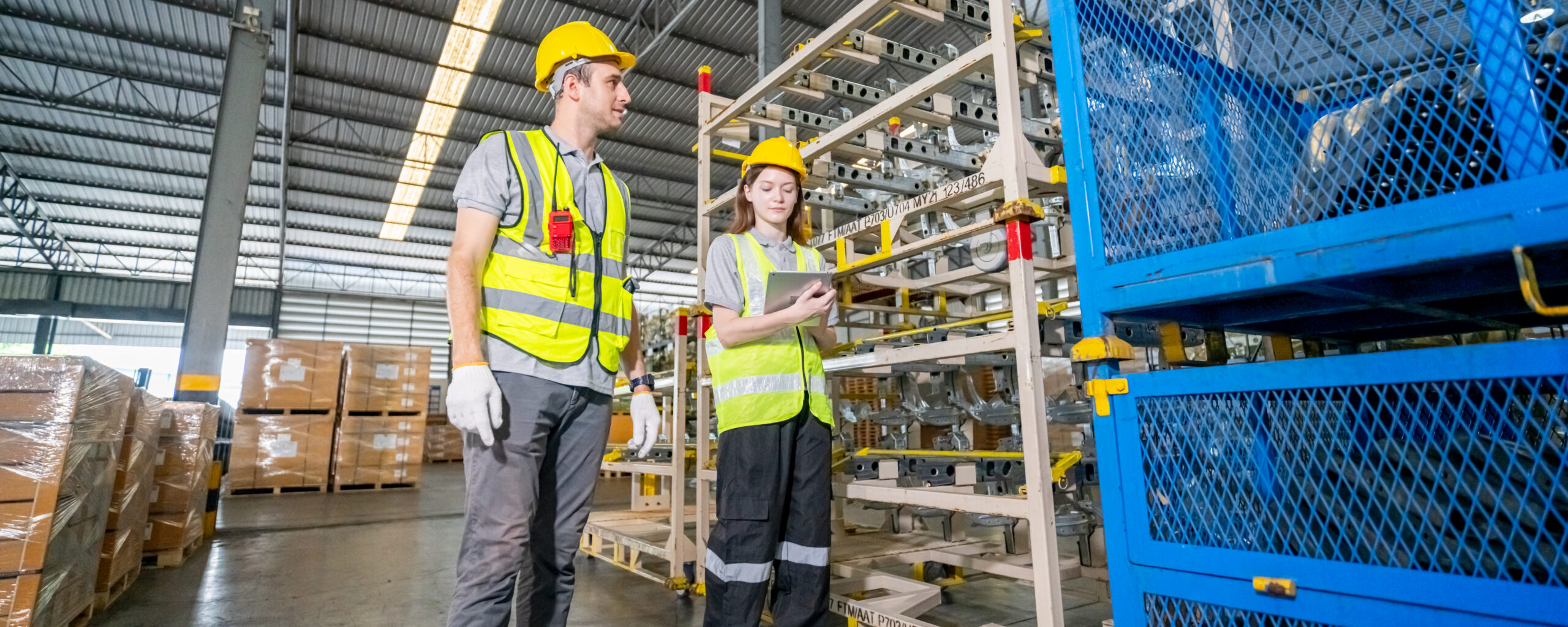 warehouse employees checking a warehouse collaboration system